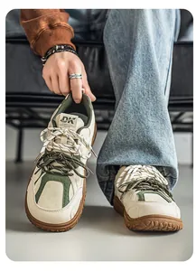 Close-up detail of retro wide-toe sneakers featuring olive accents and thick soles