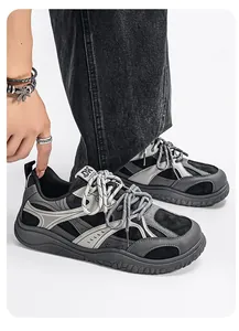 Detailed view of men's chunky retro sneakers with wide toe and thick sole design