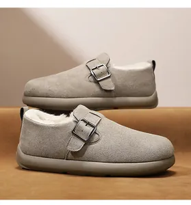 Detailed close-up of men's winter suede loafers featuring warm plush lining and metal buckle.