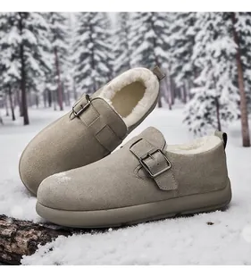 Close-up of men's winter khaki fleece-lined Birkenstock clogs set against a snowy forest