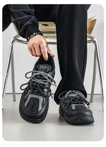 Close-up of retro black chunky men's sneakers with wide-toe and thick sole design