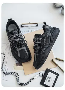 Close-up of mens chunky retro sneakers with dual-tone laces and textured soles
