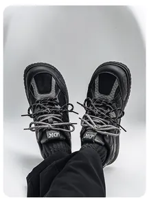 Macro view of retro black chunky sneakers with double laces and wide toe design