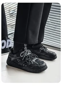 Close-up view of black retro wide-toe sneakers featuring a thick anti-slip sole design