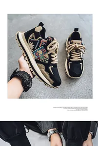 Close-up of men's low-top sneakers with ethnic woven patterns and chunky soles