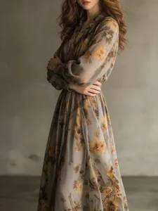 Detailed view showing the vintage floral print and chiffon fabric of the maxi dress