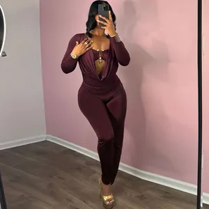 Sexy slim-fit burgundy long sleeve jumpsuit with cowl neck and metallic hardware detail