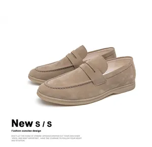 Close-up of stylish beige suede loafers for men featuring a classic slip-on design