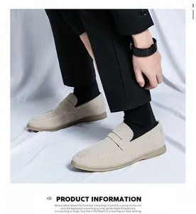 Close-up of stylish beige suede slip-on loafers for men in a business casual look