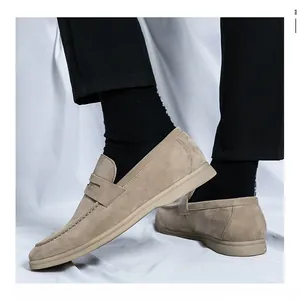 Detailed view of khaki suede slip-on loafers for men in a trendy business casual style