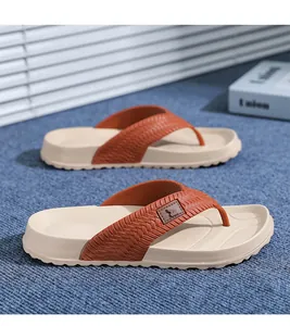 Close-up detail of men's non-slip platform flip-flops featuring orange woven straps