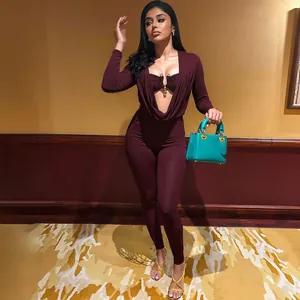 Detailed view of a sexy burgundy long-sleeve jumpsuit with a draped neckline