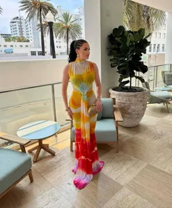 Detailed view of a vibrant gradient sleeveless maxi dress with a stylish waist cutout