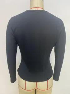 Rear view of slim fit black ribbed long sleeve Henley t-shirt displayed on a mannequin