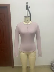 Close-up of a lilac long sleeve rib-knit Henley top displayed on a mannequin.
