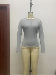 Detailed shot of a women's grey slim fit ribbed Henley neck long sleeve casual T-shirt