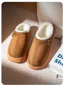 Macro detail of brown platform clog with soft white fur lining and buckle strap.