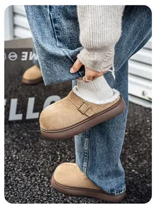 Detailed view of khaki platform Birkenstock-style clogs with warm fleece lining