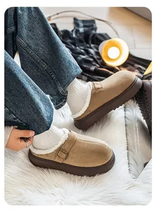 Close-up of cozy platform fur-lined clogs with buckle strap and shaggy rug background