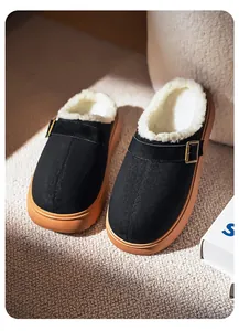 Close-up of thick sole black clogs with warm white plush lining and buckle detail