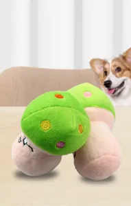 Detailed view of the plush mushroom pet squeaky toy with colorful embroidered dots.