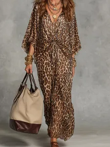 Detailed view of women's leopard print V-neck maxi dress with waist twist design