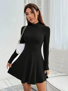 Full body detail of a black mock neck ribbed knit slim fit A-line mini dress on model