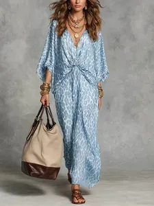 Elegant blue leopard print V-neck maxi dress featuring long sleeves and cinched waist