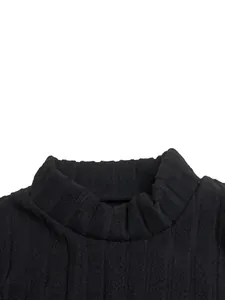 Macro detail of the black ribbed knit fabric and mock neck collar on a slim dress