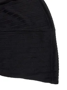 Close-up detail showing the soft black ribbed knit fabric texture of a long sleeve A-line dress