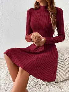 Detail view of burgundy ribbed knit long sleeve dress with mock neck