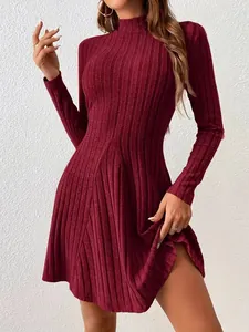 Detail view of a burgundy ribbed mock neck A-line dress with slim fit long sleeves