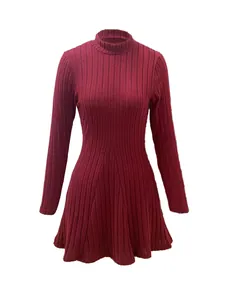 Macro detail of the high-quality burgundy rib-knit fabric on a slim-fit A-line dress.