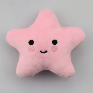 Simpatico gioco per cani a forma di stella rosa in peluche con squittio su grigio