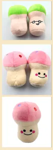 Detail view of soft plush mushroom dog squeaky toys featuring cute embroidered faces.