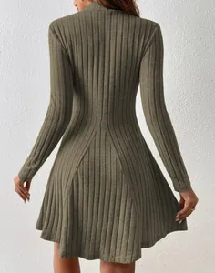 Back view of a mock neck ribbed knit A-line dress in olive green, showing slim fit.