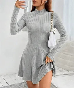 Detailed look at the texture and fit of the gray ribbed knit high-neck mini A-line dress