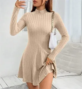 Detail view of a slim fit beige mock neck ribbed knit A-line dress for autumn and winter