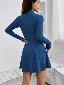 Back view of a slim fit long-sleeved blue ribbed mini dress showing high collar detail