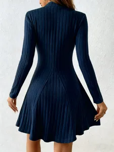 Back view detail of a navy blue long-sleeved ribbed dress with a slim A-line silhouette.