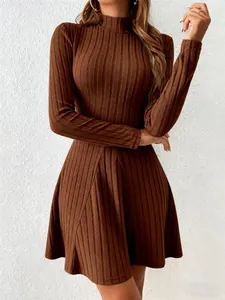 Detailed close-up view of brown ribbed knit fabric on a slim-fit mock neck dress