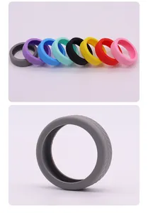 Detailed view of multi-color silicone luggage wheel protectors with non-slip tire tread texture