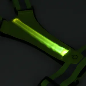 High-visibility LED reflective safety vest glowing in the dark for night running.