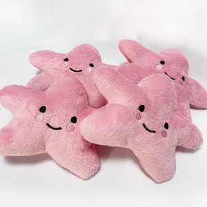 Pink star-shaped squeaky plush toy with a cute smiley face for dogs and cats