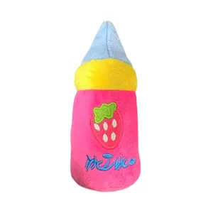 Plush dog chew toy shaped like a pink milk bottle with cute strawberry embroidery detail