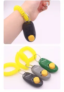 Pet dog training clickers with wrist strap in multiple colors on white background
