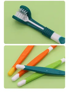 Close-up detail of the three-sided pet toothbrush head and colorful anti-slip handles