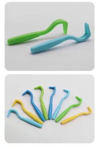 Detailed view of professional plastic tick remover hooks for pets in mixed colors