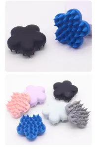 Close-up detail of flower-shaped silicone pet massage bath brushes in various colors.