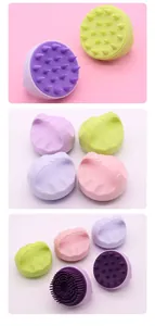 Detailed view of colorful silicone pet bath brushes with massage spikes and ergonomic handles.